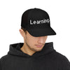 Learning... Snapback Trucker Cap